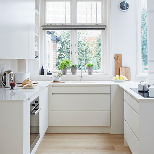 Handless u-shaped kitchen layout in white by John Lewis of Hungerford