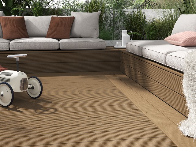 caramel coloured decking with built-in garden furniture boxed in in matching decking