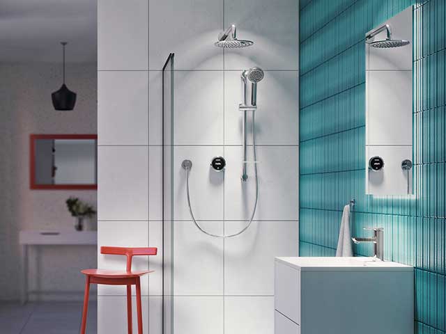 Smart shower with white tiles and blue feature wall with red furniture