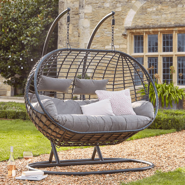 the hanging double egg chair is a trending garden furniture piece for 2022