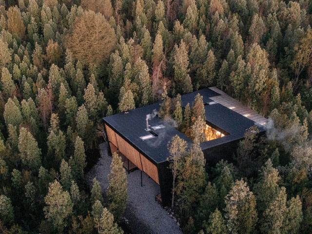 timber house on the slopes of the Villarrica volcano in Molco, Chile