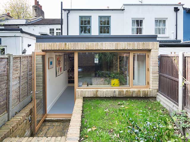 eco friendly extension with scaffolding boards from the outside