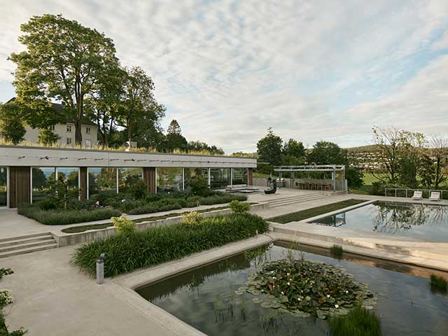 single storey building with natural pools in front