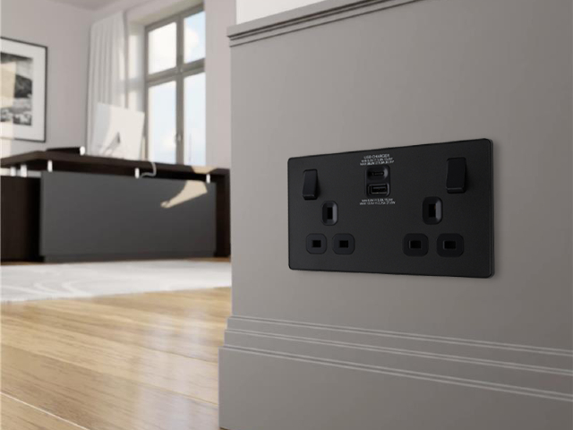 modern home with matt black decorative wiring accessories, grey walls and wooden floors