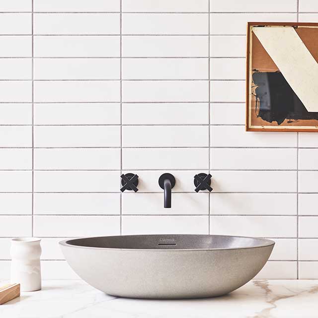 Eco bathrooms basin on white tiled background