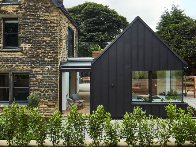 modern extension on a traditional victorian villa with lots of contemporary galzing