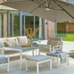 2.5m cantilever parasol over garden furniture on a patio adjacent to new kitchen extension