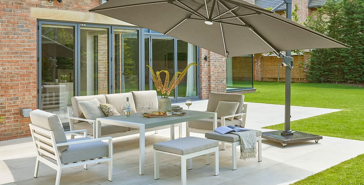 2.5m cantilever parasol over garden furniture on a patio adjacent to new kitchen extension