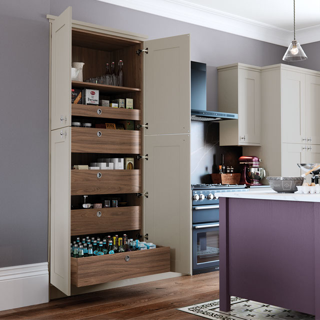 floor-to-ceiling larder cupboard in lilac grey with purple kitchen cabinets