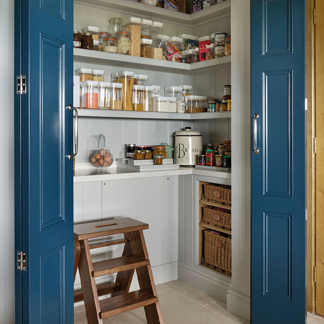 small walk in pantry with bi-fold doors in blue