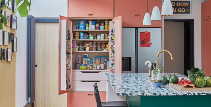 pink pantry cupboard in a contemporary kitchen