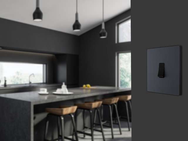 Screwless light switch in black on a black wall