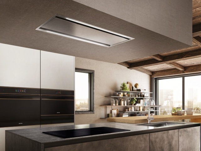 stylish extractor fan above contemporary stone kitchen island with wooden breakfast bar
