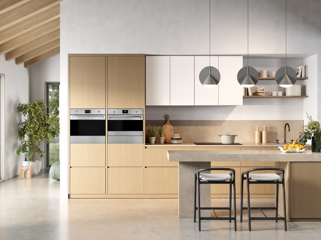 sleek chrome oven and discreet hob in minimalist kitchen with neutral colour scheme