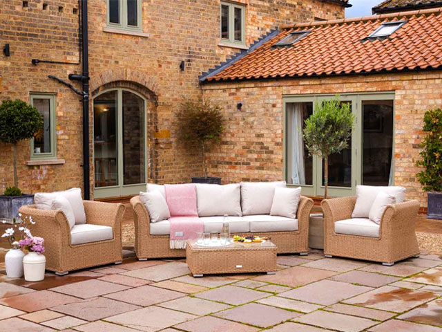 garden furniture on sale: three-piece rattan outdoor sofa set with oatmeal cushions