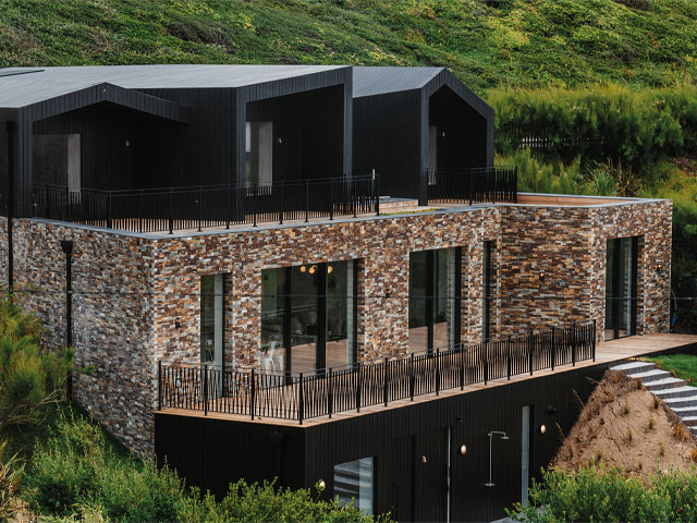 coastal home in Cornwall with concrete piles drilled into the bedrock to create solid foundations