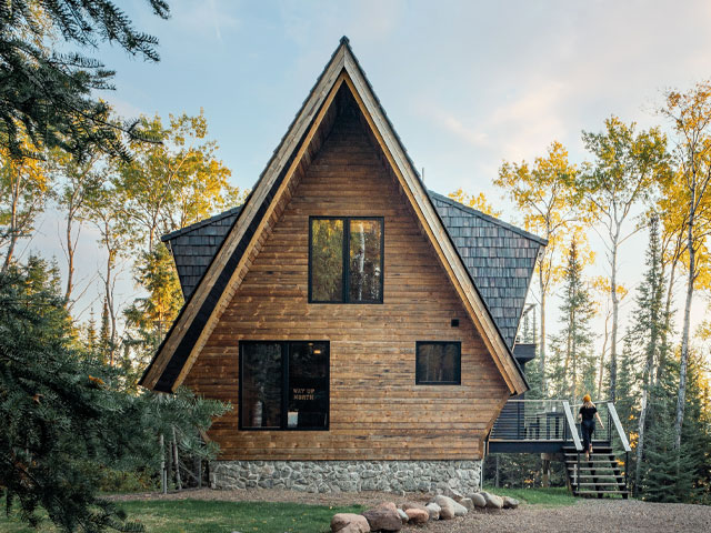 thi wooden cabin by Devil Track Lake in Minnesota was refurbished using SIPs to withstand the harsh winter weather