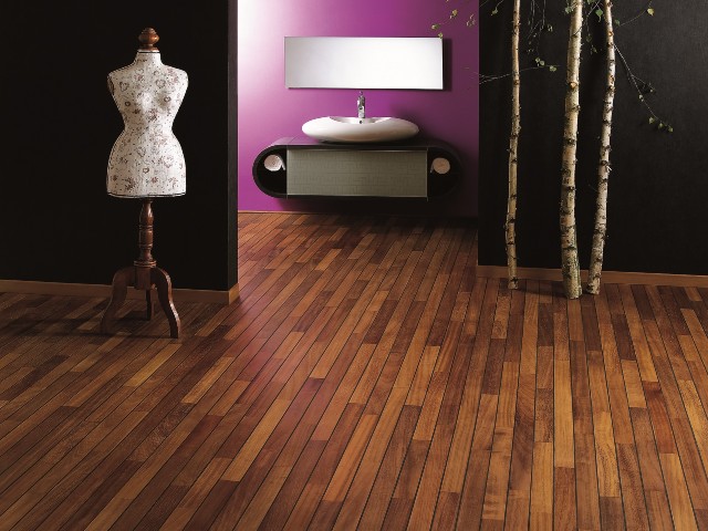 large bathroom and dressing room with purple and black walls and timber floor