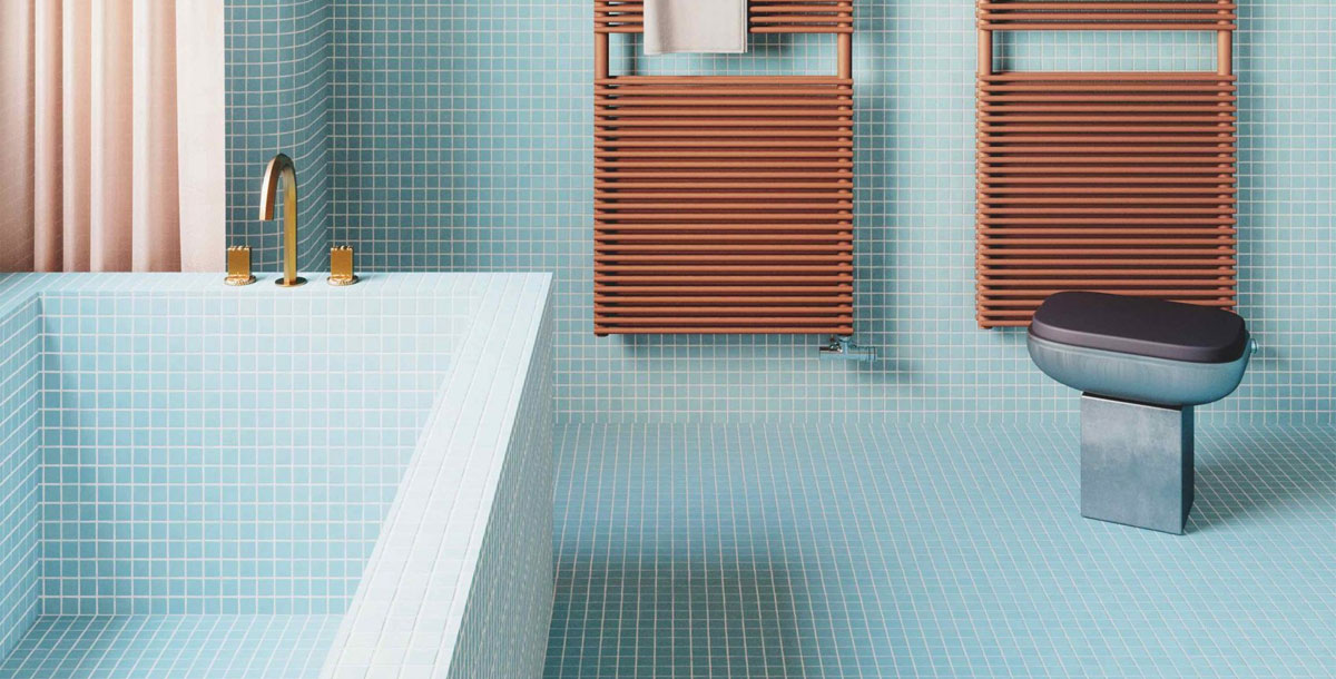 retro bathroom design scheme with pale blue mosaic tiles on the floor, walls and bath