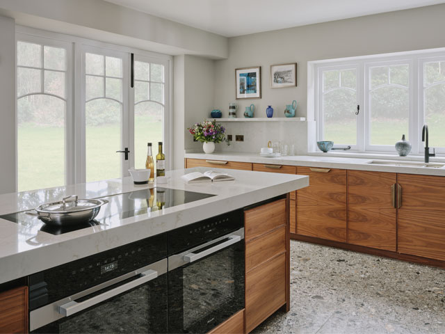 large kitchen with walnut veneer and zinc panels on the large kitchen island
