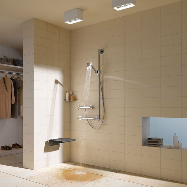 Plan 90-degree grab bar and sliding rail system, thermostatic shower mixer and wall-mounted, foldaway seat from Keuco 
