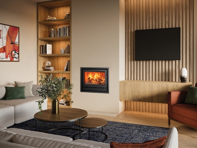 high-efficiency wood burning stove inset into chimney breast in renovated home