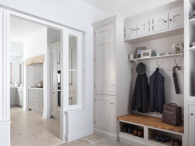 traditional kitchen design with matching utility room cabinets in oatmeal beige