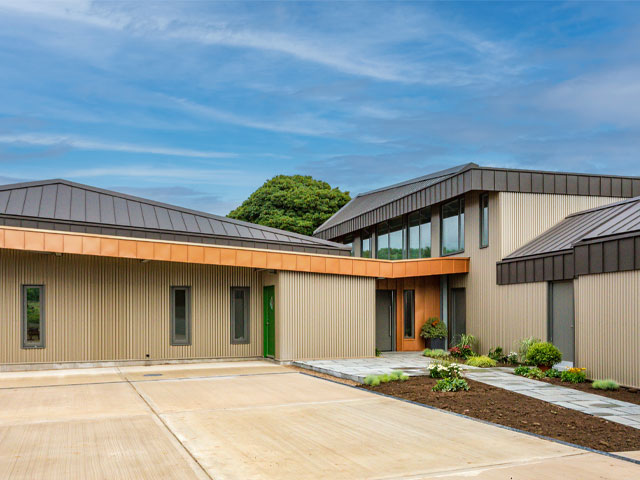 the multi-pitched standing seam aluminium roof of the Grand Designs Derbyshire longhouse