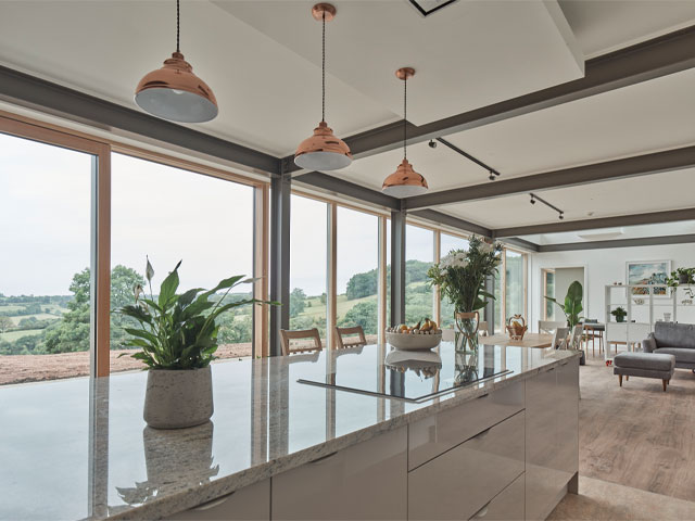 open-plan kitchen with view over the Derby Dales in the Grand Designs Derbyshire longhouse