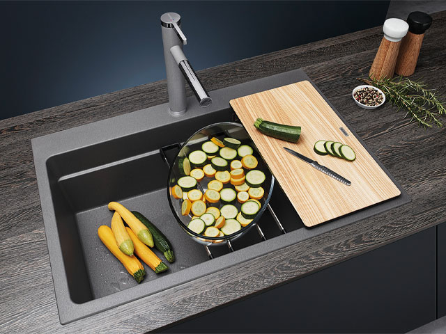 multifunctional kitchen sink with integrated chopping board and pan rests