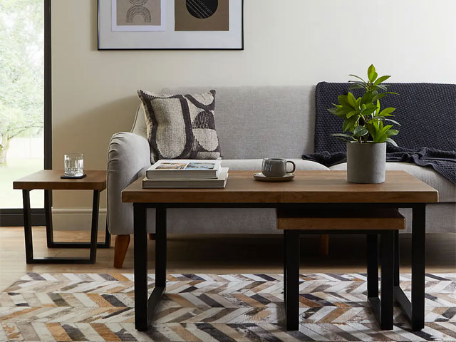 Mid-Century modern wooden-effect furniture on chevron rug with grey sofa