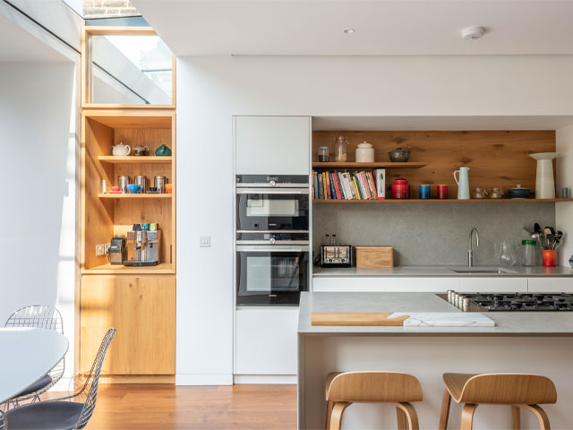 modern kitchen extension with rooflight joining the extension to the original house