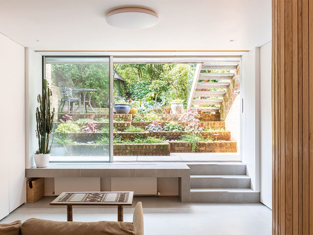 a double-height extension brightens up the lower ground floor of this london townhouse