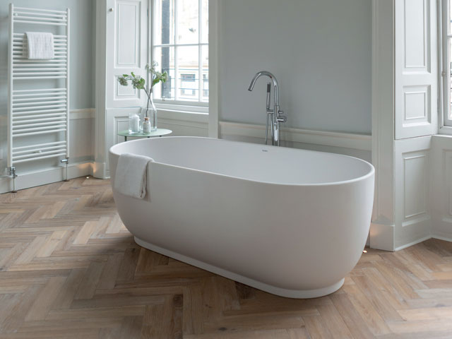 engineered oak parquet bathroom floor laid in a herringbone pattern 