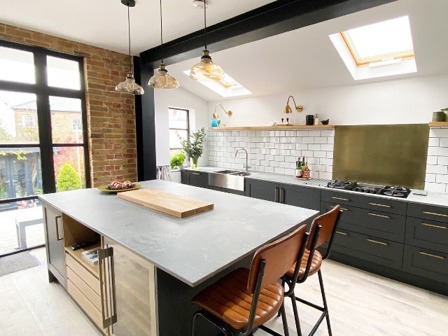 kitchen extension with sloping roof, skylights and open shelving instead of wall cabinets