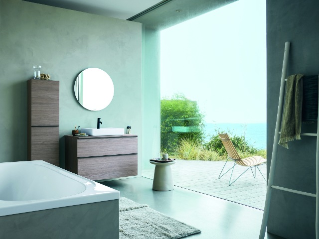 The Philippe Starck bathroom collection by Duravit in a contemporary bathroom with floor-to-ceiling window