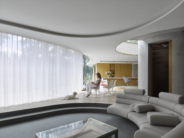 acoustic solutions: quiet track for curtains and blinds in a luxury home with curved windows
