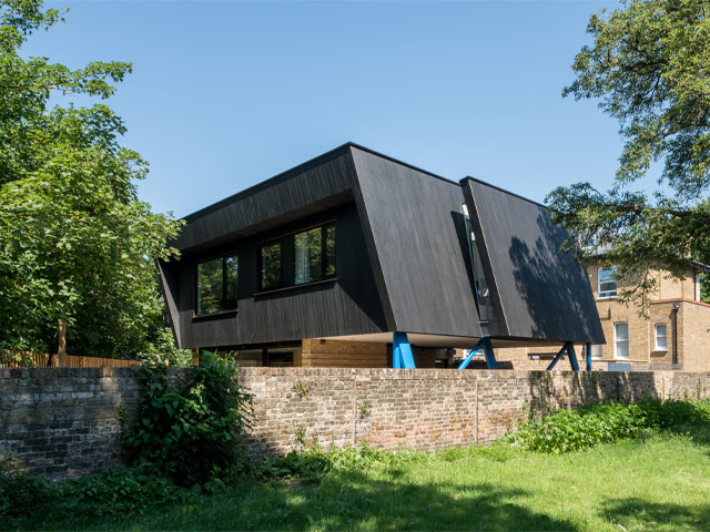 contemporary new build with black timber cladding on a scrap of land in Brockley, south east London