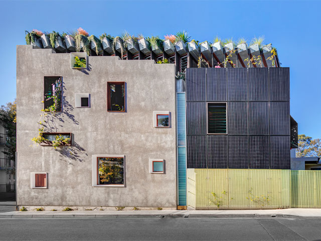 contemporary eco home in conservation area with plants on the roof