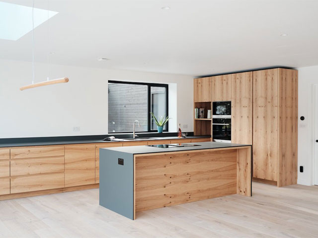 Fenix-Grigio-worksurfaces and wood kitchen cabinets-by-Finch-London