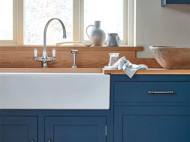 eco-friendly kitchen worktops: FSC-certified oak worksurface with butler sink and blue cabinets