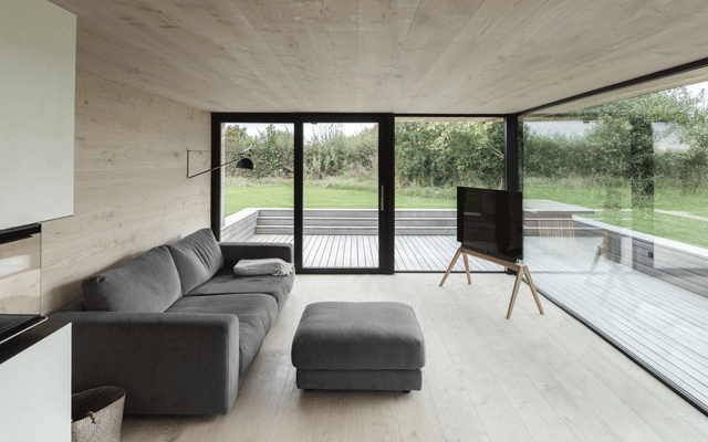 A minimal living room in an extended thatched cottage
