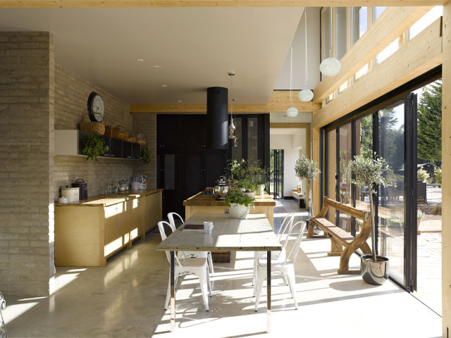 Inside the Grand Designs York home: an open-plan kitchen with exposed brick walls and large expanses of glazing