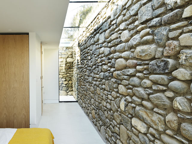 Splashes of bold colour break up the predominantly white palette. Grand Designs Wales. Photo: Andrew Wall