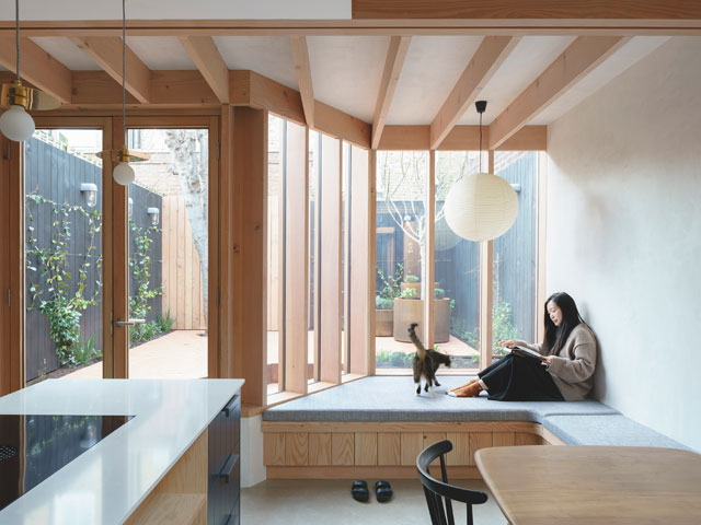 This design has a Douglas fir frame, which contrasts with the house’s original brickwork. For planning approval a report demonstrating how the scheme met planning policy and complements the house was written. Photo: Emil Eve Architects