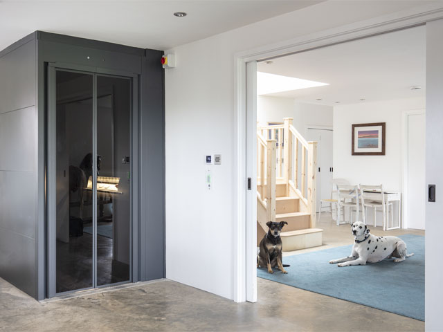The extra-wide opening from the kitchen to the hallway can be closed off with space-saving sliding pocket doors. Photo David Giles