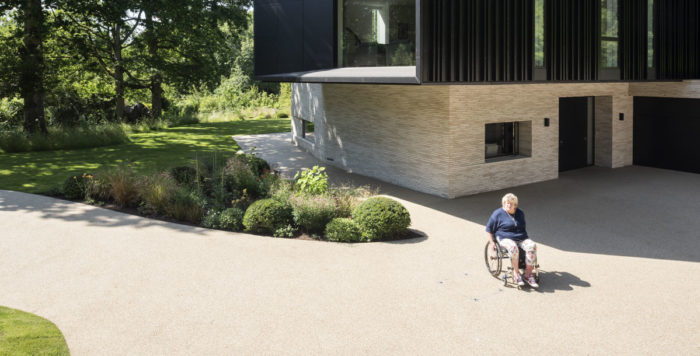 Accessible home design - Jo Wright outside her wheelchair friendly home in Hampshire
