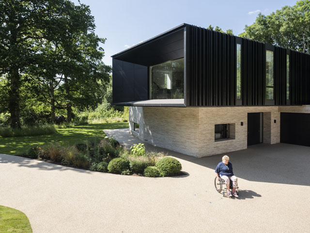 Accessible home design - Jo Wright outside her wheelchair friendly home in Hampshire