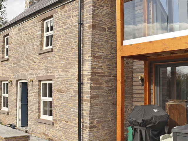 Modern kitchen extension to an old cottage in Wales