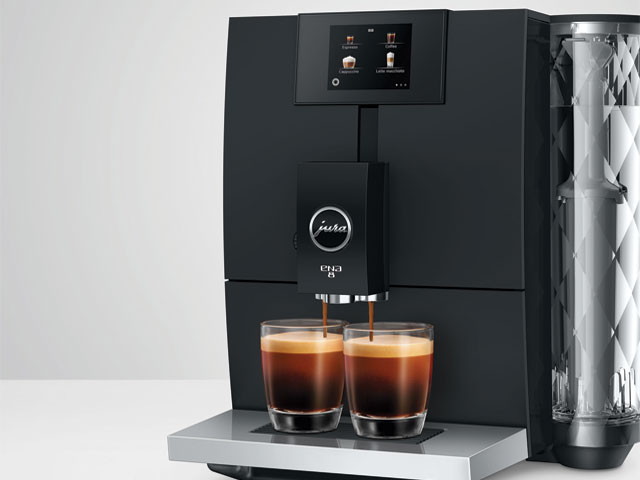quiet coffee machine on a grey background with two espressos